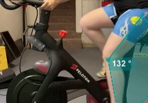 Cyclist on stationary bike indoors