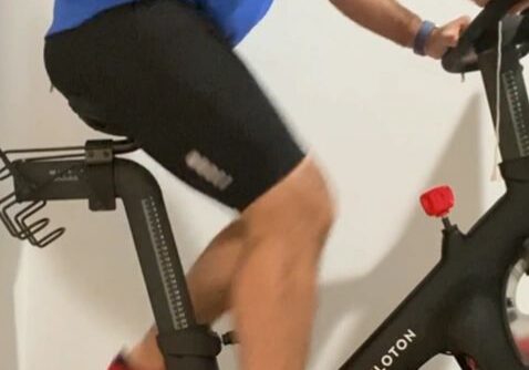 Cyclist exercising on stationary bike