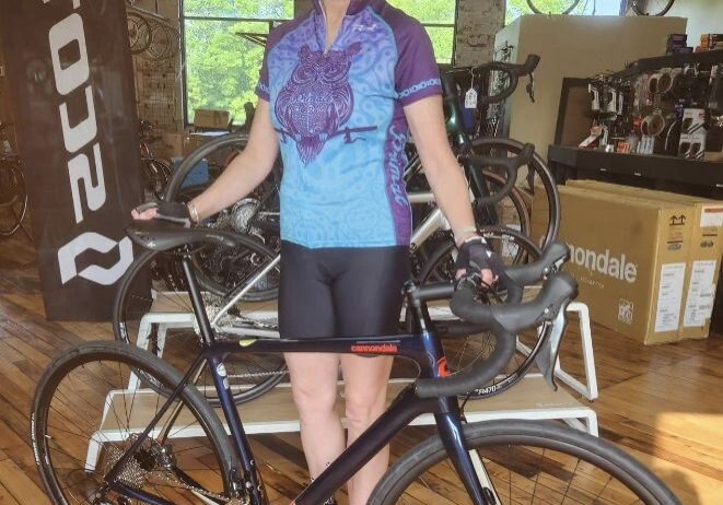 Cyclist posing with new bike