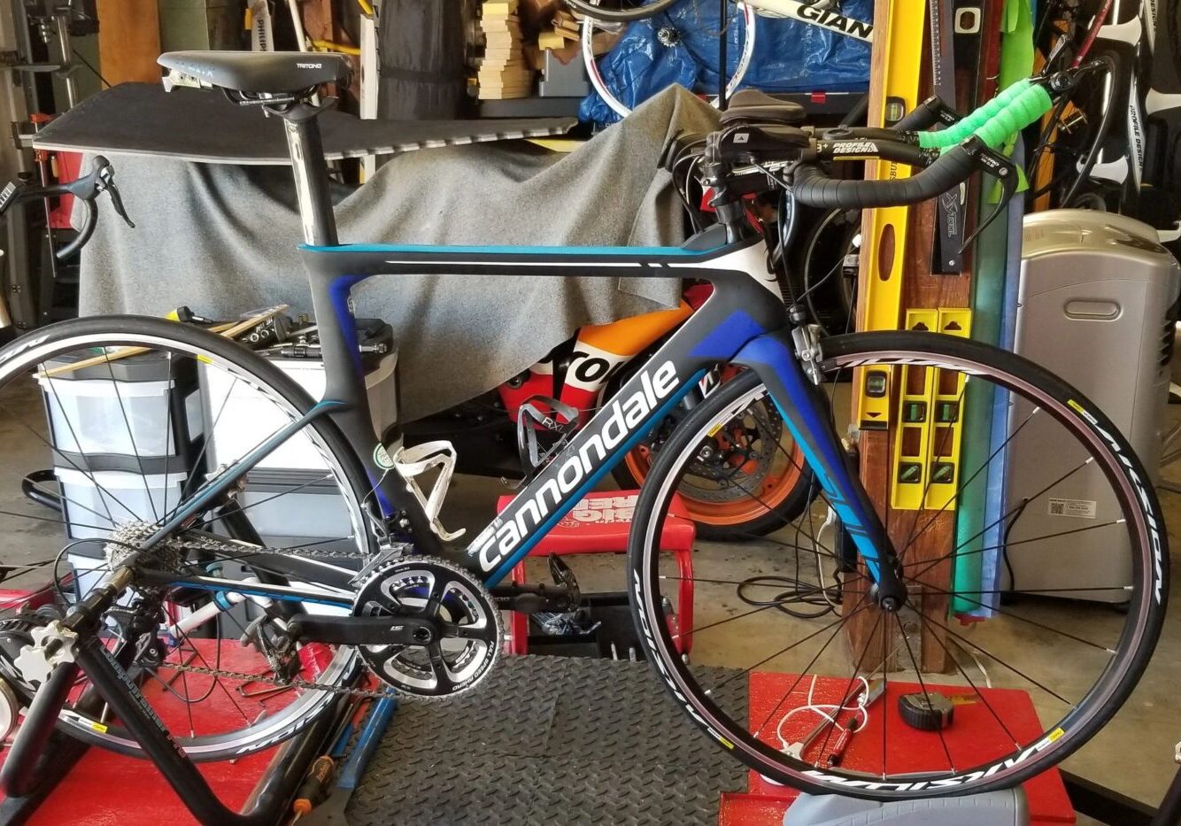 Blue Cannondale bicycle in workshop