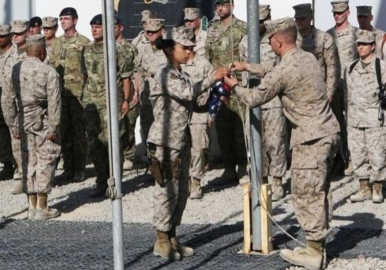 Service members gathered for a flag event