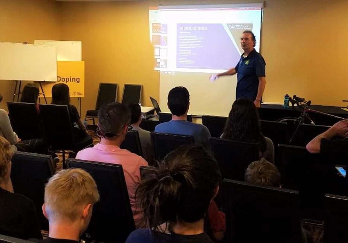 Speaker discussing doping awareness in seminar