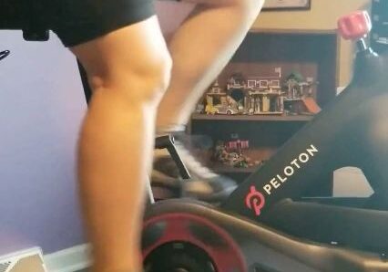 Person exercising on Peloton bike